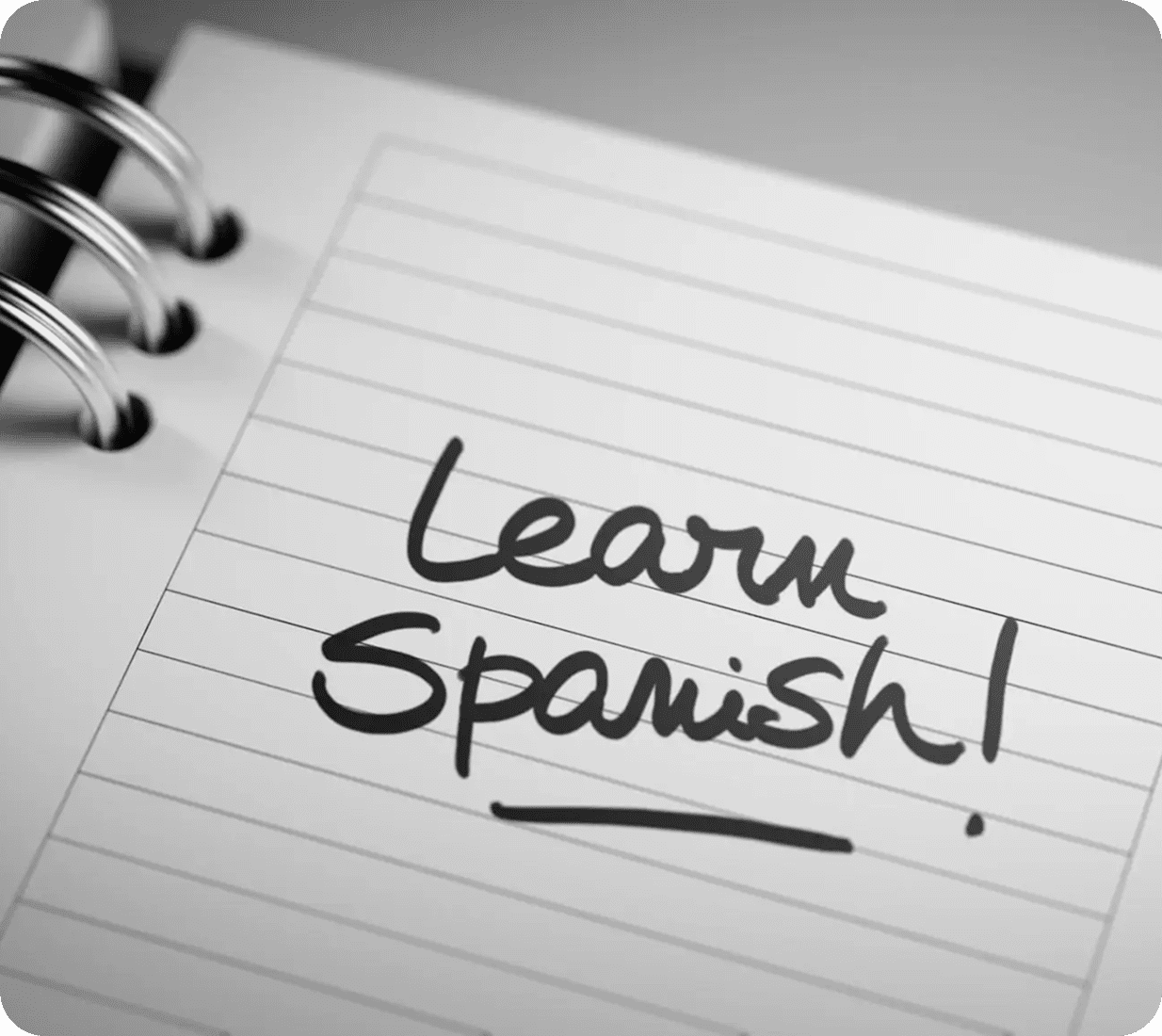 Notebook page with "Learn Spanish!" text