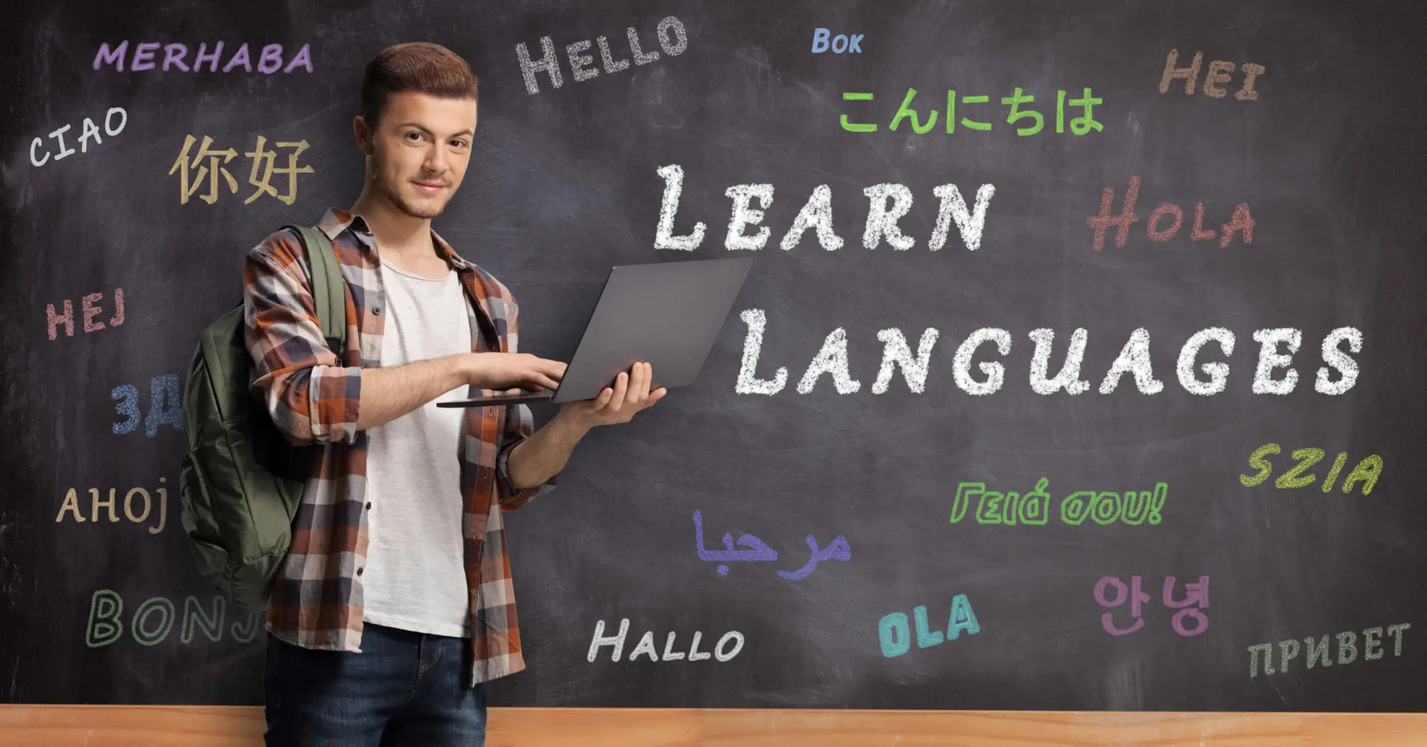 Person studying languages on chalkboard background
