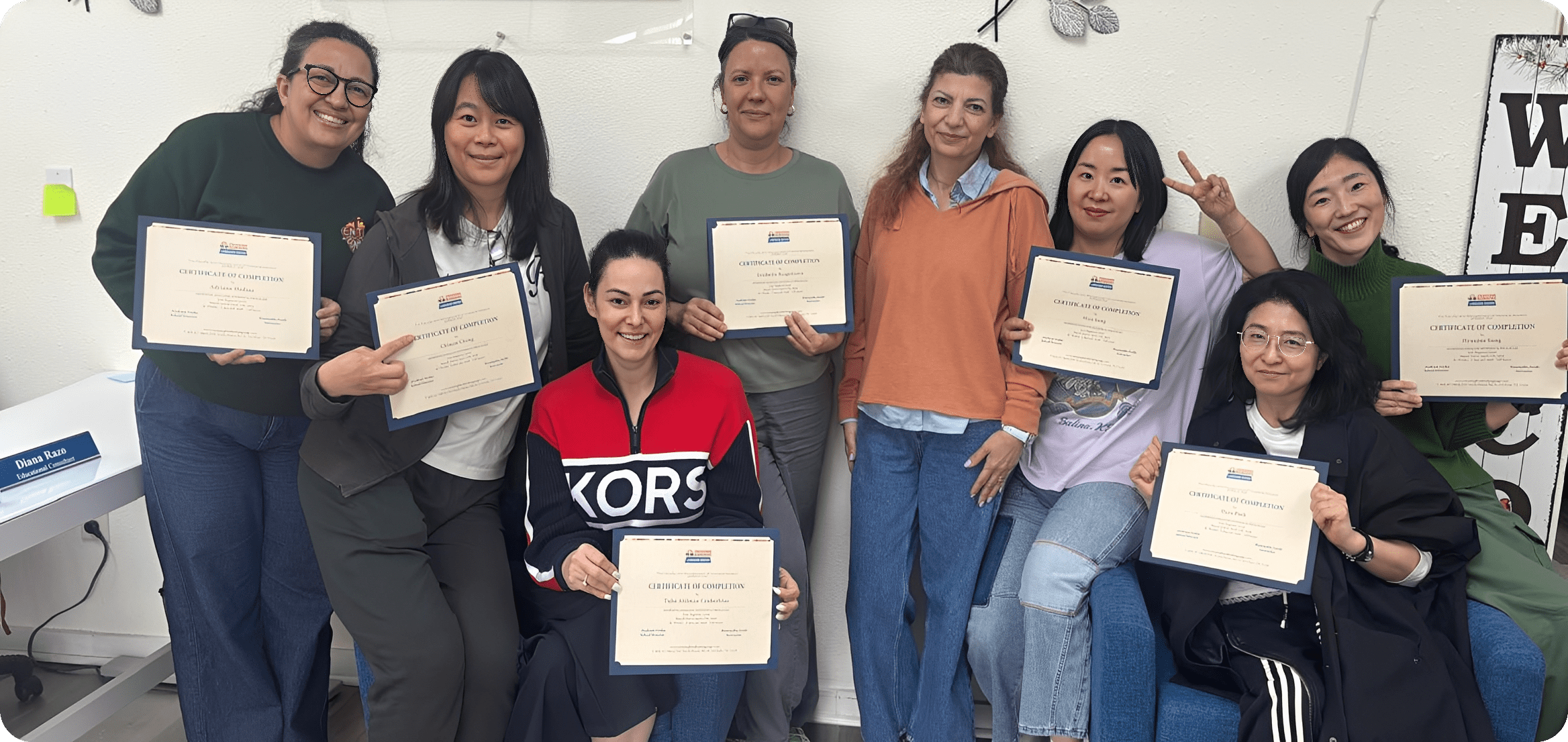 Group of smiling women holding certificates